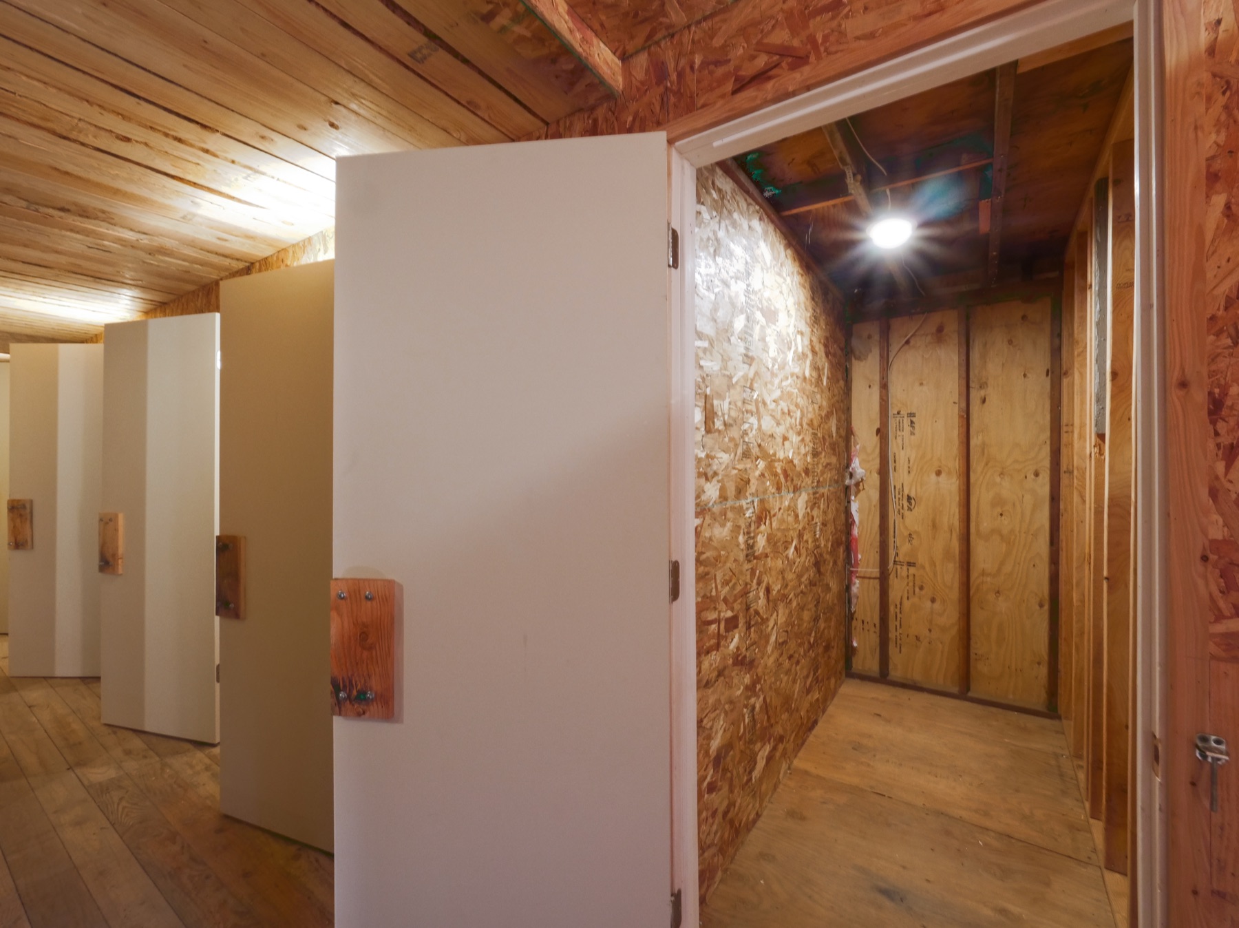 A row of lockable storage units inside the Sundance storage building